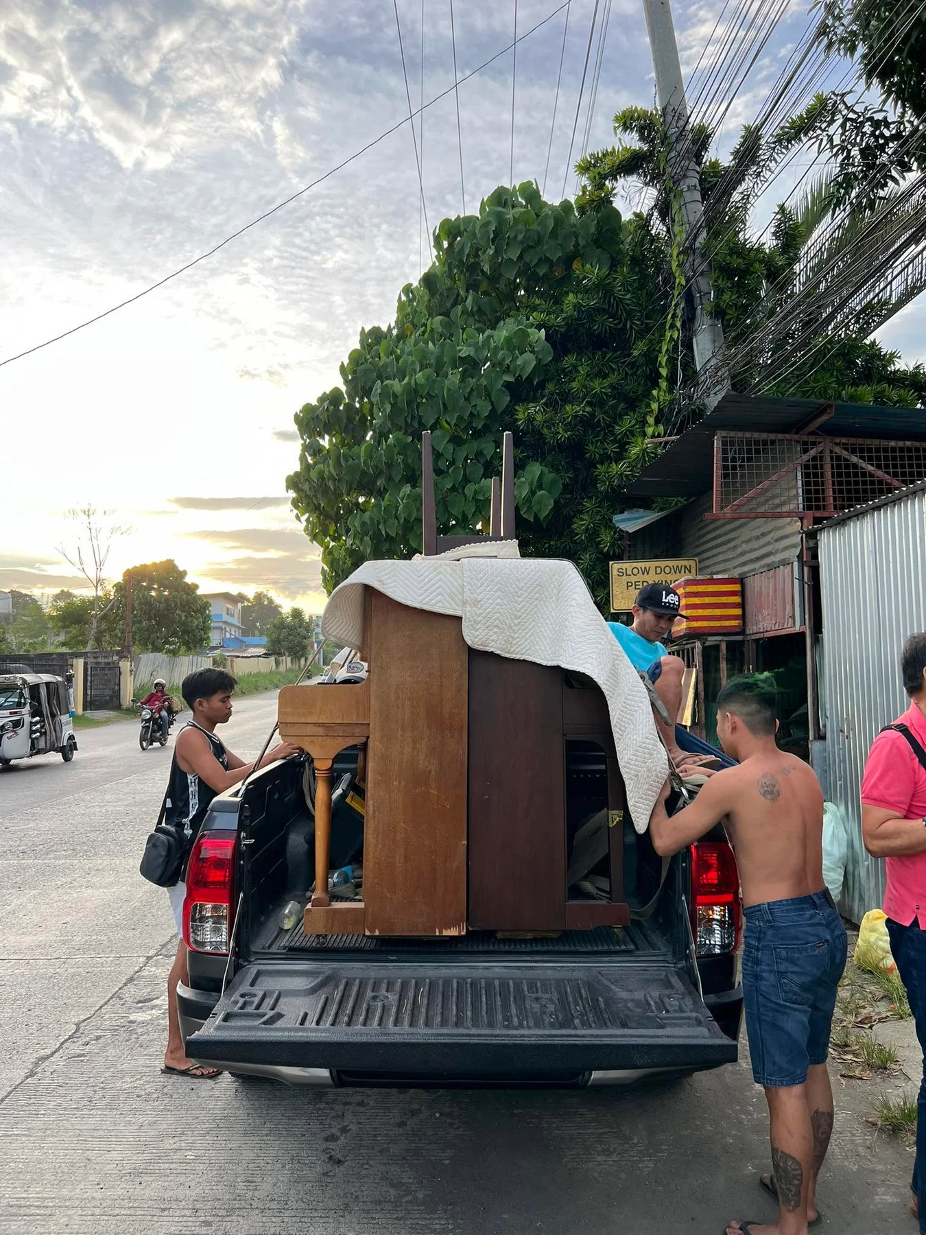 Upright piano being loaded for delivery