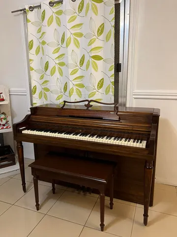 Wood-finish console piano