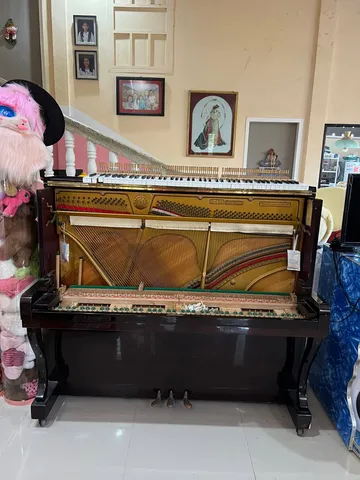 Upright piano · keys removed for access
